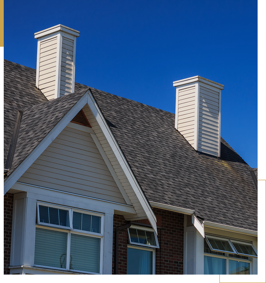 House roof with two white chimneys
